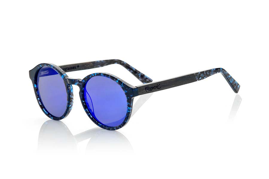 Wood eyewear of Ebony ZORGE. ZORGE sunglasses of the MIXED PREMIUM series are manufactured with the front in acetate quality in color black with blue sparkles carey and sideburns in natural EBONY wood finished in Rod covered with acetate carey with blue flashes that can be adjusted if necessary. It's a model rounded suggestive shapes that are perfectly to people of both sexes and have been combined with grey lenses or blue REVO series. The quality of the materials and their perfect completion will surprise you. Front size: 140x51mm for Wholesale & Retail | Root Sunglasses® 